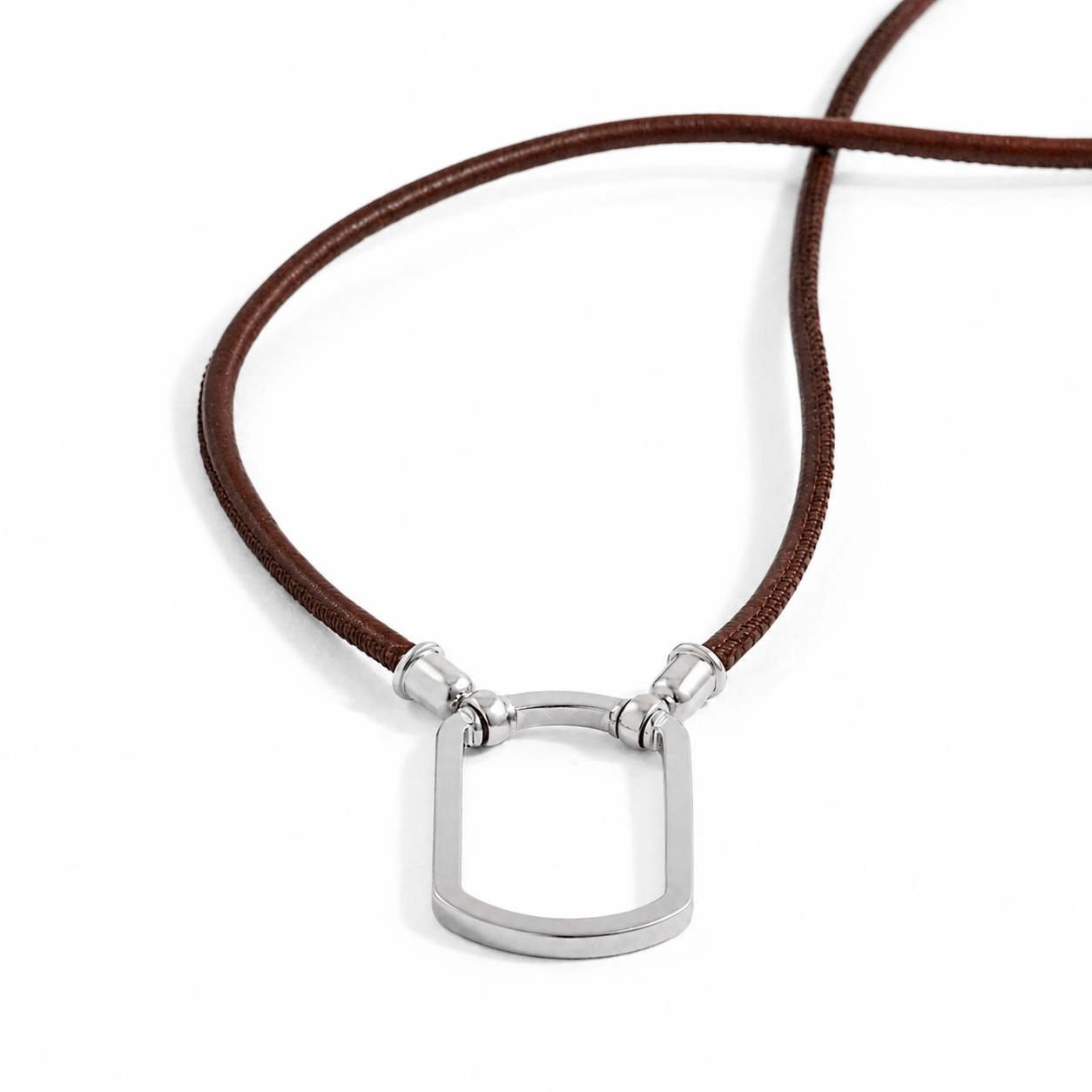 Close up of the Allegra Tag in chocolate brown leather with a rectangular silver loop
